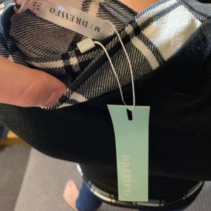 Black pull over shirt w/ plaid stitching